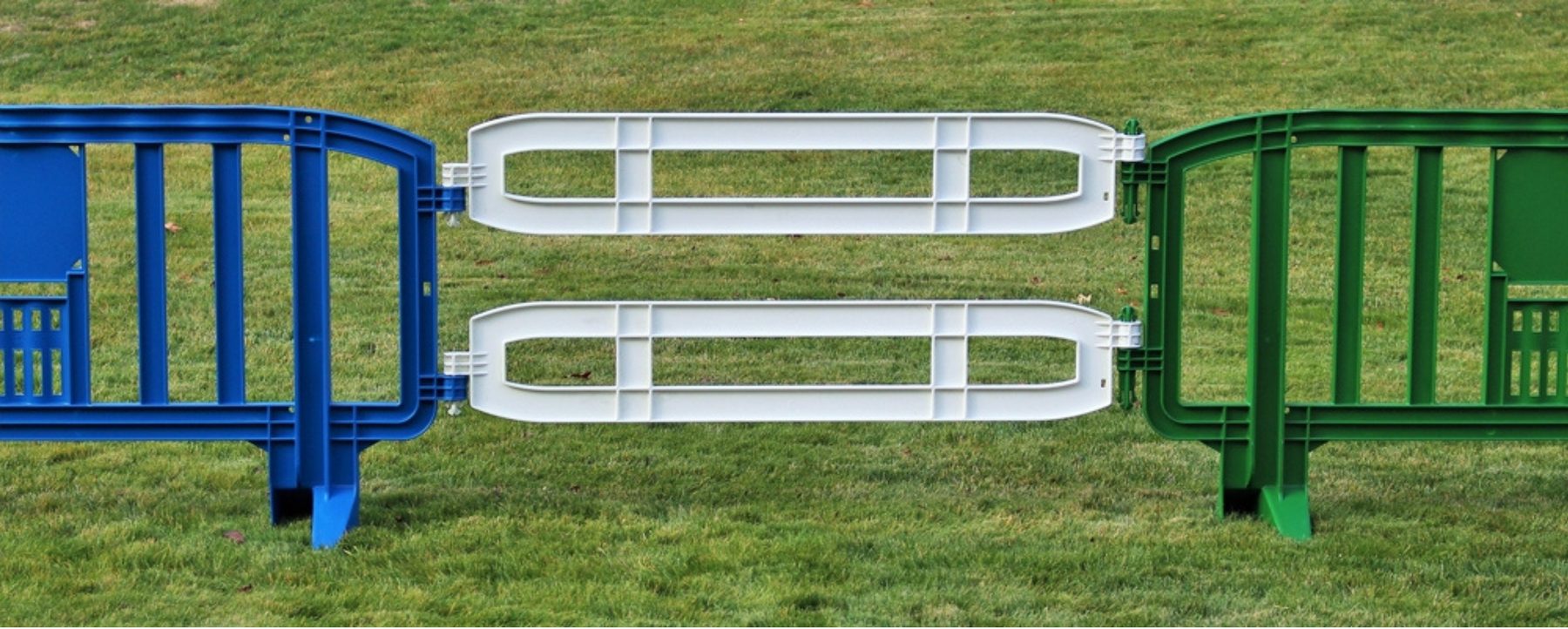 Xtendit extension linking blue, white, and green barricades on grass